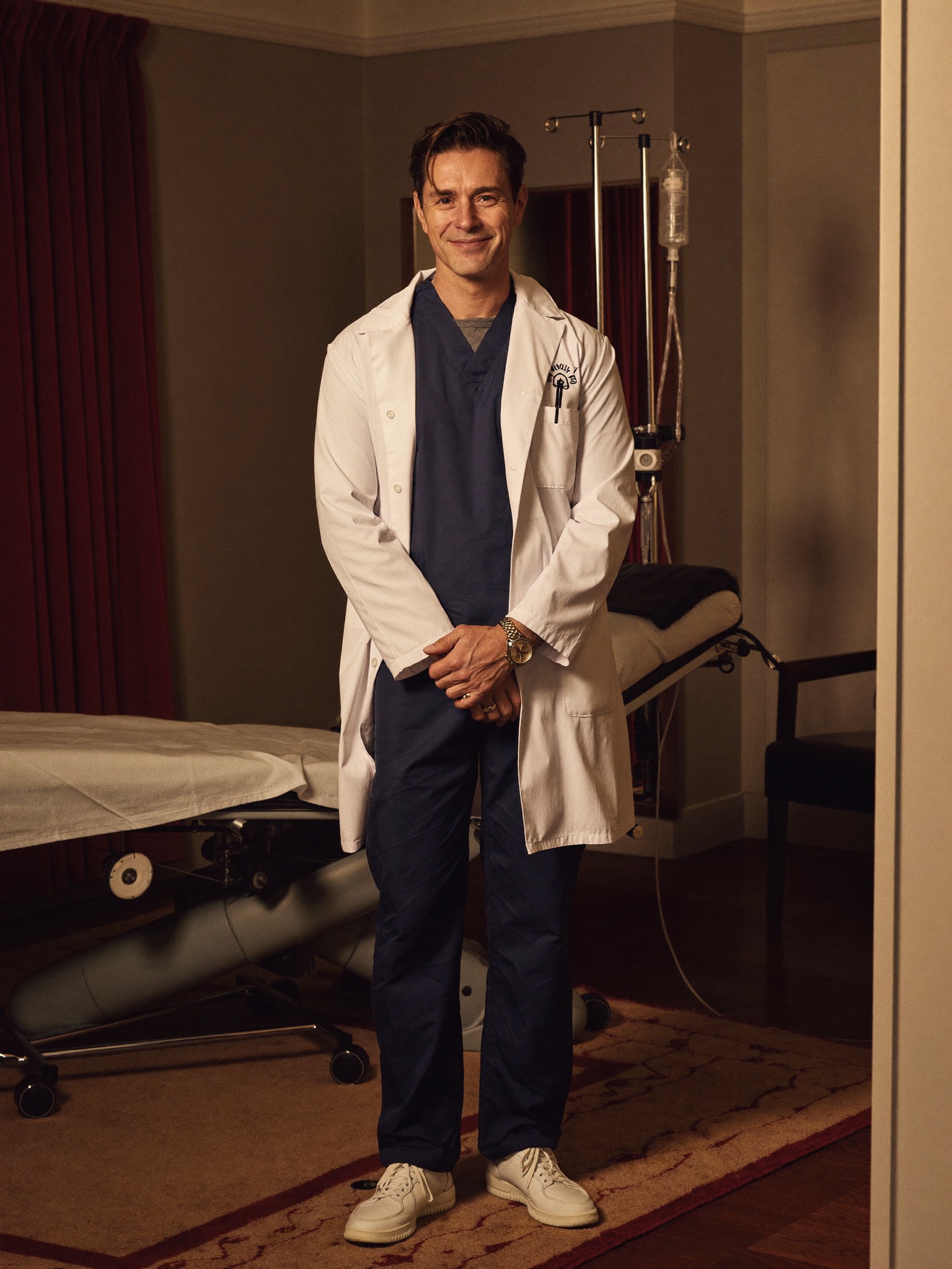 Board-certified male plastic surgeon in a discreet consultation room