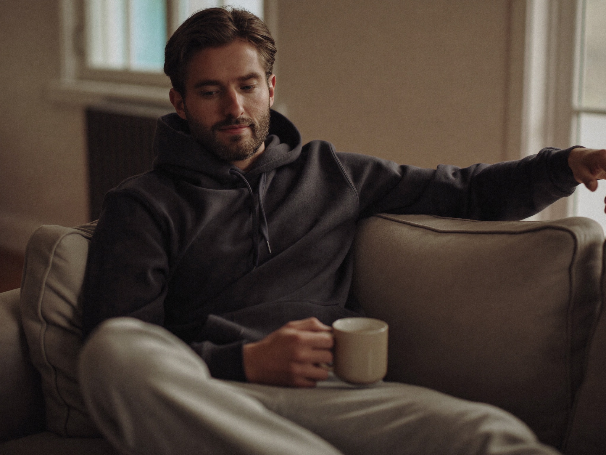 A relaxed man at home, calm and comfortable during an easy recovery